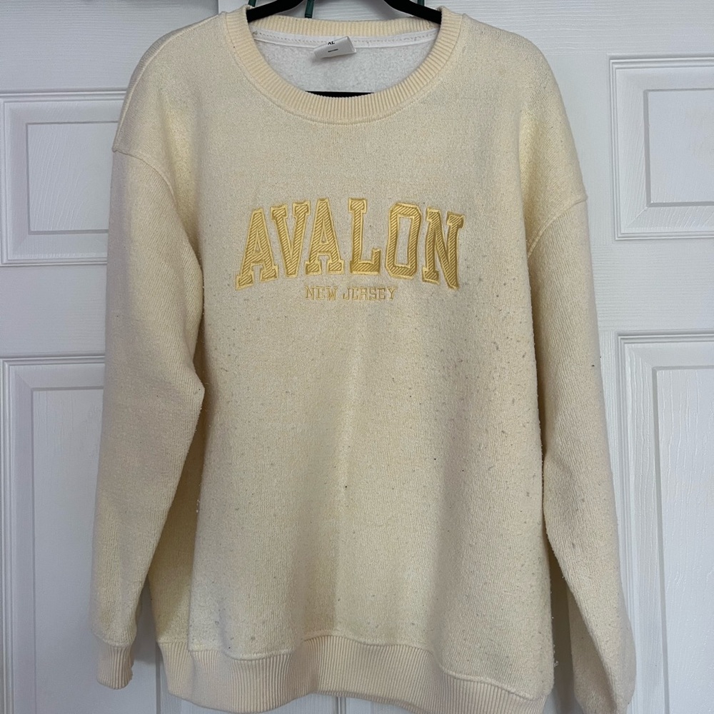 Avalon yellow sweatshirt. Small hole on front barely noticeable.